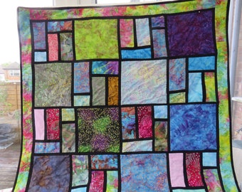 Batik Stained Glass Patchwork Quilt - Stunning Variety of Batik Fabrics - Colour Enhanced by Stained Glass Style Black Sashing