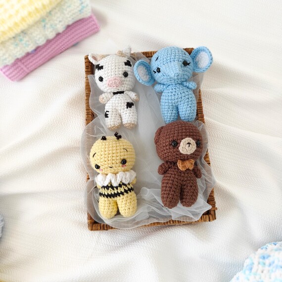 Tiny crocheted farm and forest animals with 130 favorites — impossibly cute, handcrafted miniatures that double as keychains and desk companions.
