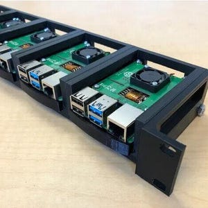 May include: A row of black Raspberry Pi cases with cooling fans and multiple blue USB ports.