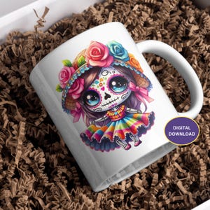 May include: White ceramic mug featuring a colourful illustration of a Day of the Dead sugar skull girl wearing a flower crown and a rainbow skirt.