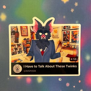 May include: A sticker featuring a cartoon bat-like creature in a blue suit and red tie. The sticker has the text "I Have to Talk About These Twinks" and the @IMSPOOK username.