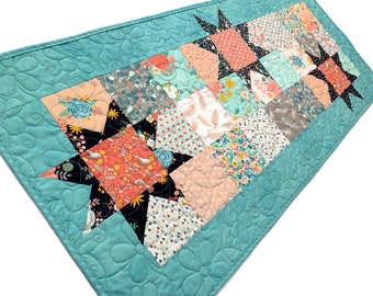 Reversible Spring Stars Table Runner in Peach, Aqua and Black