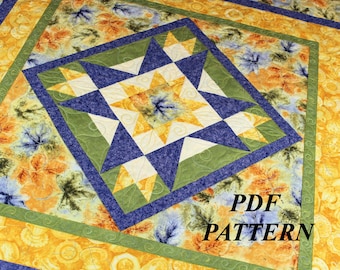 May include: A colorful quilt with a central star pattern in yellow, blue, green, and white. The quilt features a floral design in shades of yellow, orange, and blue. The text "PDF PATTERN" is visible in the lower right corner.