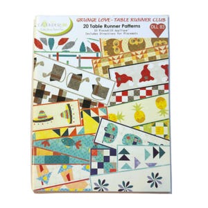 May include: A book titled "GRUNGE LOVE - TABLE RUNNER CLUB" with 20 table runner patterns. The cover displays various colorful table runner designs, including patterns with owls, pineapples, and geometric shapes. The book includes directions for placemats.