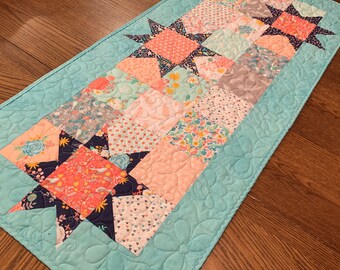 Reversible Spring Stars Table Runner in Peach, Aqua and Black