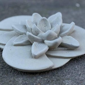 Concrete lily statue Stone flower garden ornament Handmade floral sculpture Outdoor botanical decoration Elegant lily ornament Lover gift