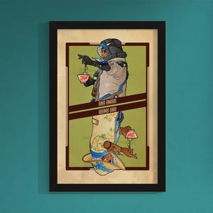 May include: Framed art print featuring a stylized illustration of a character named Ana Amari. The artwork depicts the character in two mirrored poses, holding teacups. The background is a light green with brown accents, and the text "ANA AMARI" is visible.