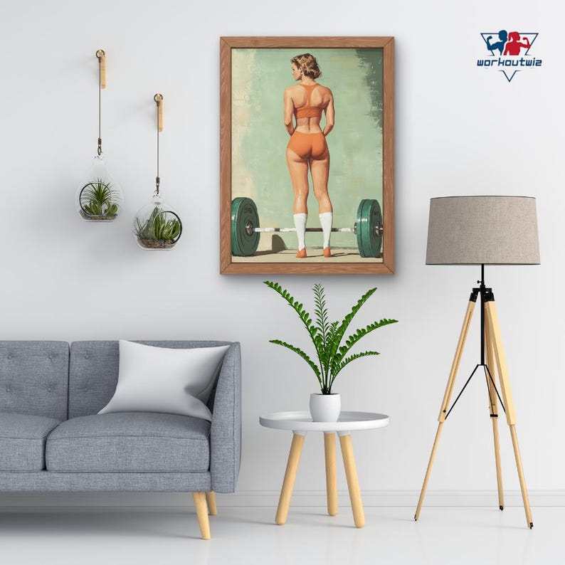 May include: A vintage-style poster featuring a woman in an orange workout outfit lifting a barbell. The poster is framed in wood and has a light blue background.