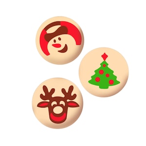 May include: Three round, beige cookies with Christmas-themed designs. One cookie has a red and white snowman, another has a green Christmas tree with red ornaments, and the last cookie has a brown reindeer with a red nose.