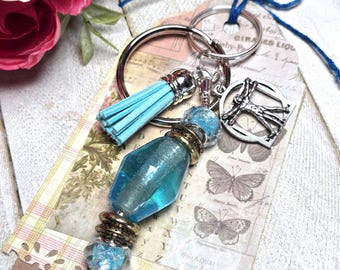 Blue Glass Beaded Keychains with Vitruvian Man charm and tassel, Qty: 1
