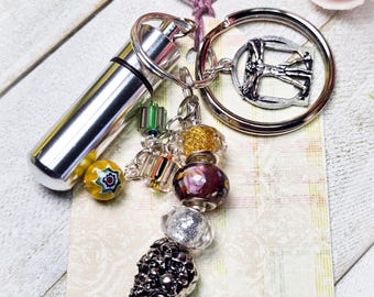 Beaded Keychains with Vitruvian Man charm and Money Cash Stash Pill Box Medicine Capsule Holder Container, Qty:1