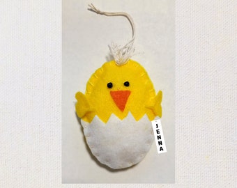 Our 4" tall by 3" wide Chick Easter or Spring Ornament hangs from a cord. Use as a package tie-on or basket tie-on..