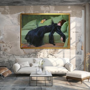 May include: A painting of a woman in a black dress lying on a green couch. The woman is holding a book in her hand and her eyes are closed. The painting is framed in gold.