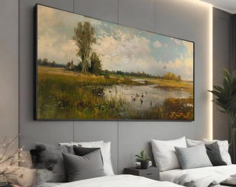 May include: Large framed landscape painting depicting a serene marsh scene. The artwork features a body of water with several birds, lush greenery, and a cloudy sky. The painting is displayed above a bed with gray and white bedding.