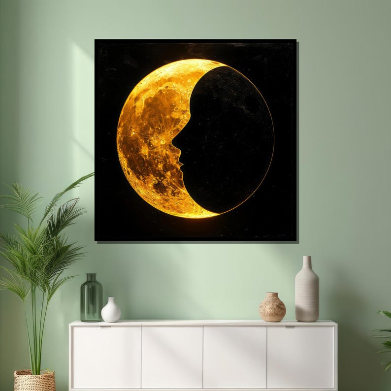May include: A crescent moon with a golden glow, with a silhouette of a face in the dark portion of the moon.