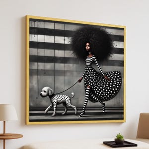 May include: A framed art print featuring a woman in a black and white polka dot dress and striped top, walking a Dalmatian dog. The background has black and white stripes. The artwork is in a gold frame.