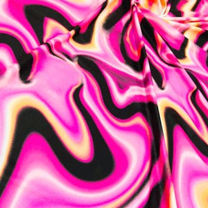 May include: Abstract fabric with a pink, black, and orange swirl pattern.