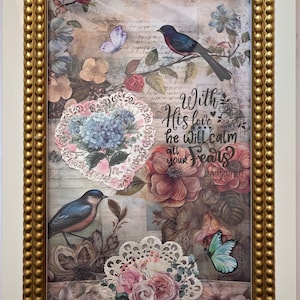 May include: Framed artwork featuring a collage of floral and bird imagery. The design includes butterflies, roses, and a scripture quote, all within a gold-colored beaded frame and a white border.