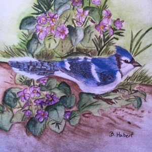 May include: Watercolor painting of a blue jay perched near purple flowers and green foliage. The bird has blue, white, and black markings. The artwork is signed "B. Hubert" in the lower right corner. The background is a soft green.