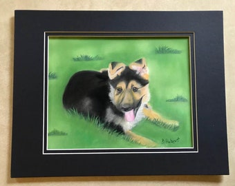 Sadie, a German Shepherd Pup, is an Original 9" x 12" Pastel painting of a German Shepherd Puppy,  laying in the grass, Double Matted