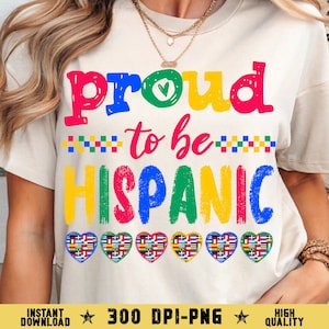 May include: A cream-colored t-shirt with the words "Proud to be Hispanic" in vibrant rainbow colors. The design includes heart shapes filled with flags and the text "Instant Download 300 DPI-PNG High Quality".