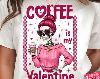 May include: White t-shirt featuring a skeleton with pink hair, heart-shaped sunglasses, and a pink sweater, holding a coffee cup. The text "COFFEE is my Valentine" is displayed in pink. The design includes hearts and stars.