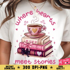 May include: White t-shirt with a graphic of a pink teacup on a stack of books. The design includes the text "where hearts meet stories" in pink, along with hearts and bows. The image also includes the text "4 colors" and "300 DPI-PNG".