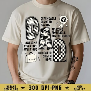 May include: Cream-colored t-shirt with the word "DAD" in a bold, graphic design. The "D" is black and white zigzag, the "A" is a black and white cloud pattern, and the last "D" is a black and white checkerboard. Additional text includes positive adjectives.