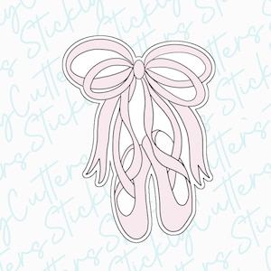 May include: A pink ballet shoe cookie cutter with a bow on top. The cutter is designed to create a detailed ballet shoe shape.