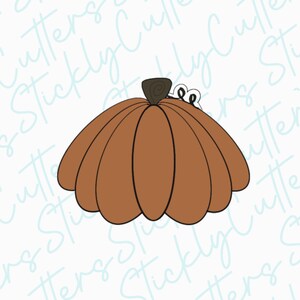 May include: A brown pumpkin cookie cutter with a swirl on top. The cutter is designed to create a pumpkin shape with a rounded bottom and a stem.
