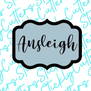 May include: A blue and black decorative sign with the word "Ansleigh" written in a cursive font.