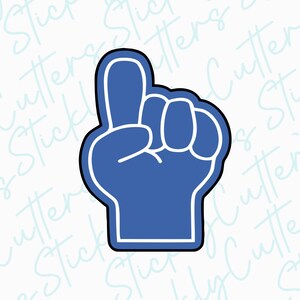 May include: A blue foam finger with a white outline, pointing up with the index finger extended. The finger is a popular sports fan accessory.