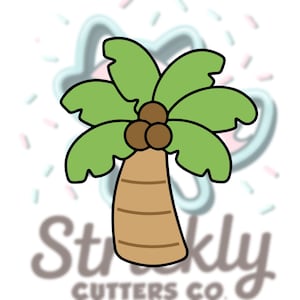 May include: A cartoon-style palm tree cookie cutter. The tree has a brown trunk, green fronds, and three brown coconuts. The cutter is outlined in black. The background has a blurred logo and pastel sprinkles.
