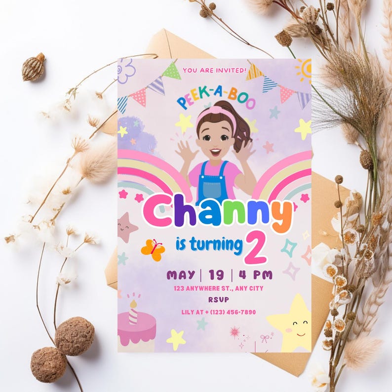 May include: A colorful birthday invitation for a girl named Channy turning two. The invitation features a cartoon illustration of a girl with a rainbow and stars. The text reads "You are invited! Peek-a-Boo Channy is turning 2 May | 19 | 4 PM 123 Anywhere St., Any City RSVP Lily at (123) 456-7890"
