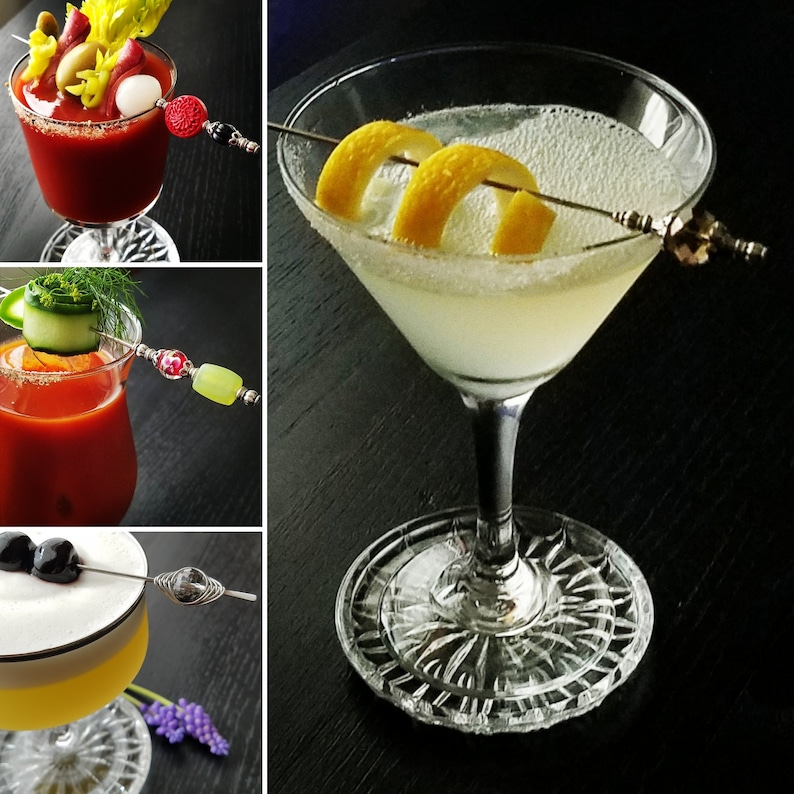 May include: Three different cocktails in clear glasses with garnishes. The first cocktail is a Bloody Mary with celery, olives, and a shrimp. The second cocktail is a classic margarita with a salted rim and a lime wedge. The third cocktail is a gin and tonic with a lime wedge and a sprig of rosemary.