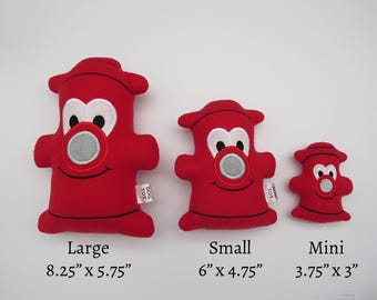 May include: Three red plush fire hydrant dog toys in different sizes. The largest is 8.25 inches by 5.75 inches, the medium is 6 inches by 4.75 inches, and the smallest is 3.75 inches by 3 inches.