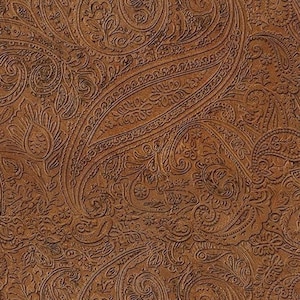 May include: Close-up of a brown paisley pattern. The design features intricate, swirling floral and teardrop shapes, creating a textured, embossed effect. The color is a warm, earthy brown, with subtle variations in tone.