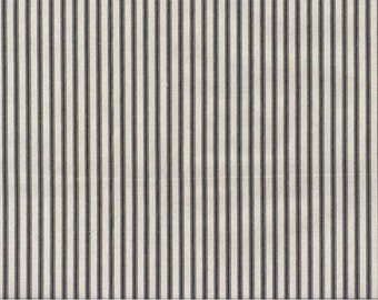 May include: A white fabric with thin black stripes. The fabric has a subtle texture.