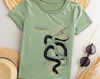May include: A green t-shirt with a black and white snake graphic and the text " Rebirth & Transformation".