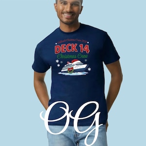 May include: Navy blue t-shirt with the text "Deck 14 Christmas Crew" and a graphic of a cruise ship wearing a Santa hat. The shirt also has the text "Hallmark Christmas Cruise 2023".