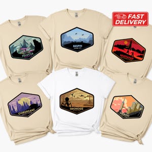 May include: Six different Star Wars themed t-shirts featuring various planets from the Star Wars universe. The shirts are beige and white with a hexagonal patch on the front of each shirt. The patches feature a silhouette of the planet and the planet's name. The planets featured are: Felucia, Bespin, Mustafar, Coruscant, Geonosis, and Naboo.
