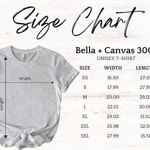 Pode incluir: Uma camiseta unissex Bella + Canvas 3001 cinza claro com uma tabela de tamanhos. A tabela lista os tamanhos XS a 3XL, com medidas de largura e comprimento em cent&iacute;metros. O texto "Size Chart" est&aacute; no topo.