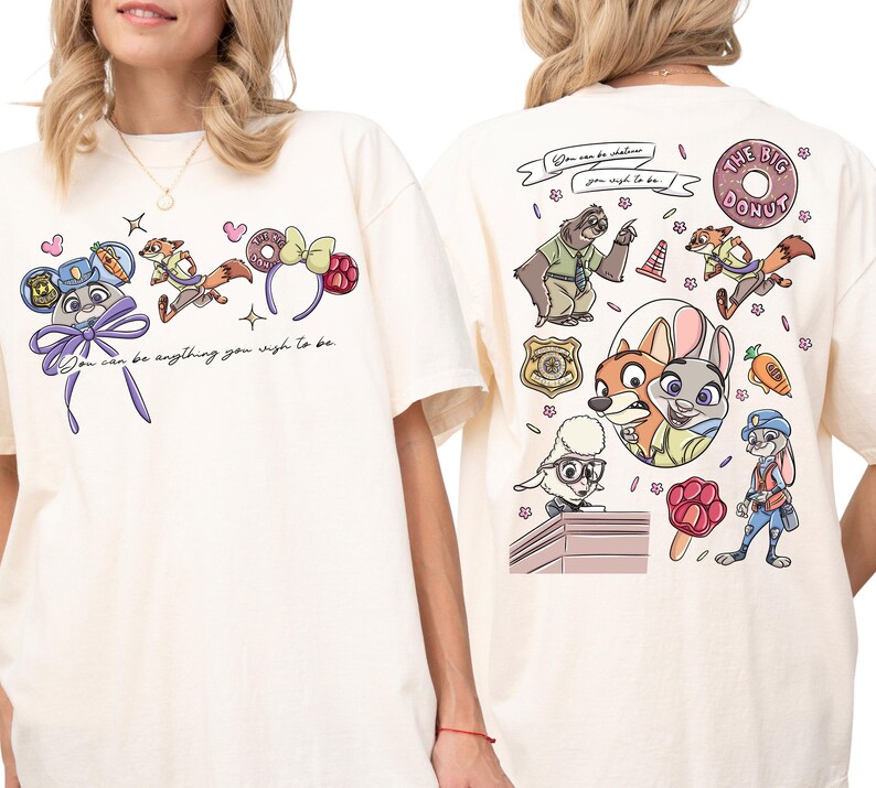 two white t-shirts with colorful cartoon characters and various designs on the back.