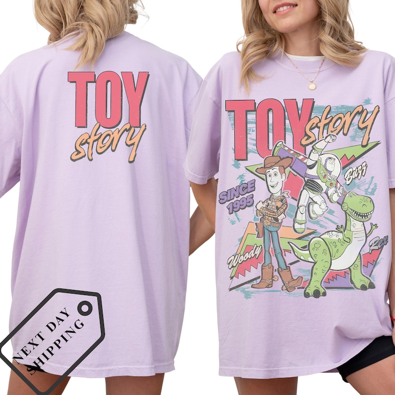 a woman wearing a pink t-shirt with a cartoon character from the Toy Story franchise.