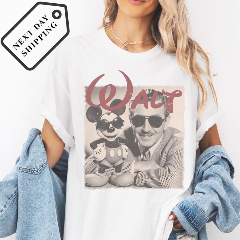 A woman wearing a white t-shirt with a graphic of Mickey Mouse and a man, along with the text "Walt".
