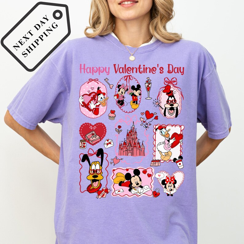 A woman wearing a purple t-shirt with various Disney characters and Valentine's Day-themed illustrations.