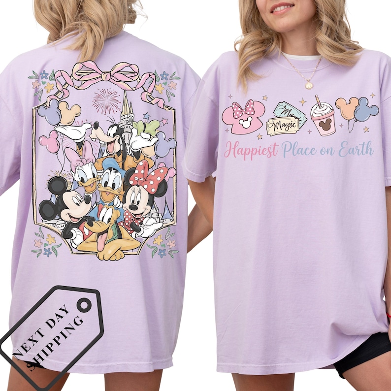 a woman wearing a purple t-shirt with a Disney character design on the back.