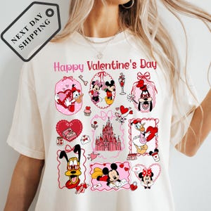 A white t-shirt with a collage of various Disney characters and elements, including Mickey Mouse, Minnie Mouse, Goofy, and other iconic Disney characters, along with a castle and hearts. The text "Happy Valentine's Day" is displayed above the characters.