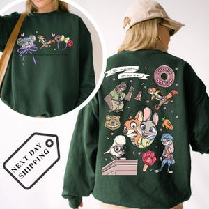 The image is a collage of two photos. The first photo shows a person wearing a green sweatshirt with a cartoon character design, including a rabbit, fox, and other animals. The second photo shows the back of the same person wearing a green sweatshirt with a cartoon character design, including a rabbit, fox, and other animals.
