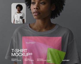 May include: A gray t-shirt mockup featuring a pink and green design. The text "T-SHIRT MOCKUP®" is displayed in white. The image includes a smaller inset image of a person wearing a white t-shirt with a pocket.